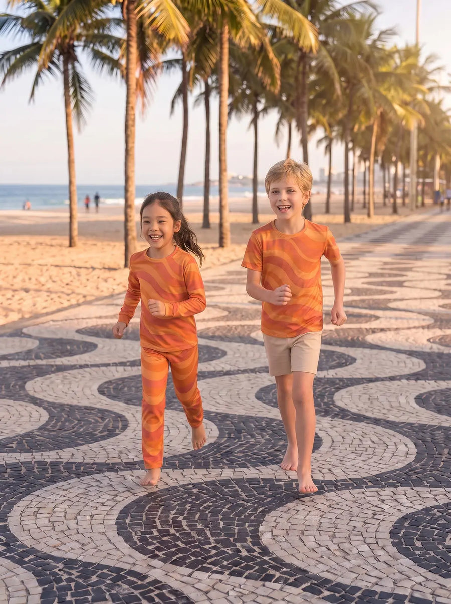 Two children in matching printed tees